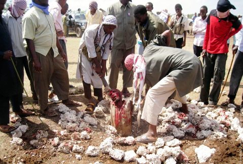 sharia law in action in Somalia, man is stoned to death by community